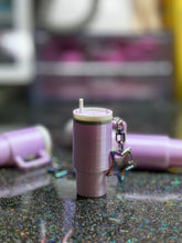 Mini tumbler fidget clicker keychain.